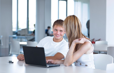 two college students having fun studying together