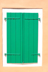 green wooden window shutters