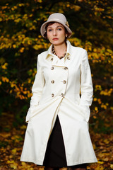 attractive woman in evening autumn park