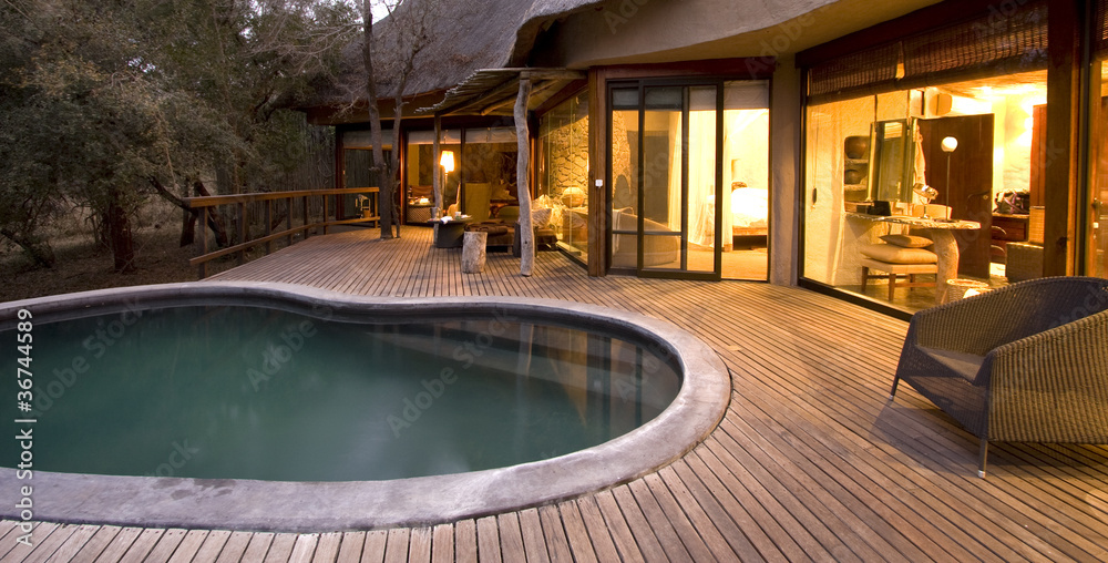 Wall mural swimming pool on a deck at a safari lodge in south africa