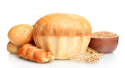 delicious round bread, buns and wheat isolated on white