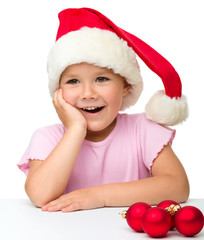 Cute little girl wearing santa hat