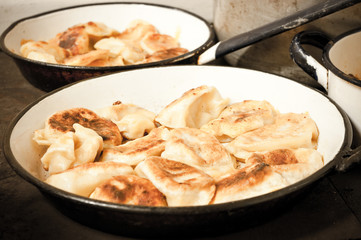 Traditional russian dumplings on the pan