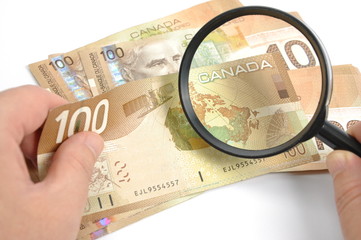 Magnifying glasses with Canadian Dollar