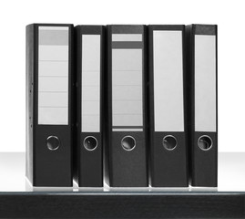 folders on desk surface