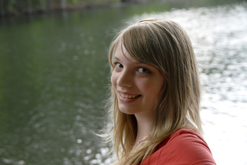 Young girl with lake behind her