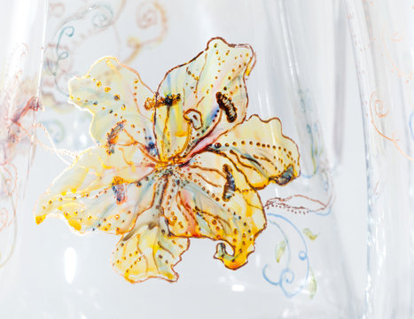 Detail of glass painted with yellow lily