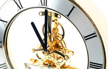 Fototapeta na wymiar gold table clock on a white background
