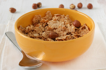 cereals with nuts in yellow bowl