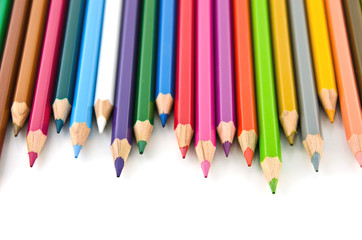 Set of colorful color pencil lined in row on white background.