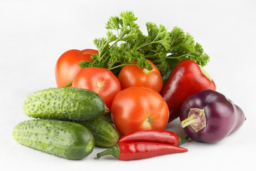 Vegetables and herbs on a white background