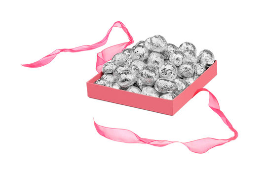 balls in aluminum foil in an open box