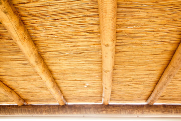 Cane sunroof with round wood beams