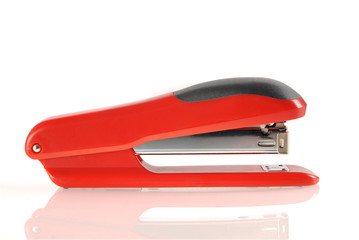 Red and black stapler isolated with clipping path