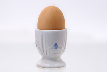 One boiled egg in egg cup.