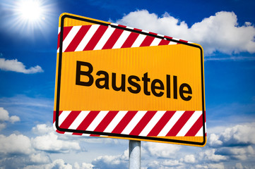 Ortseingangsschild mit Baustelle