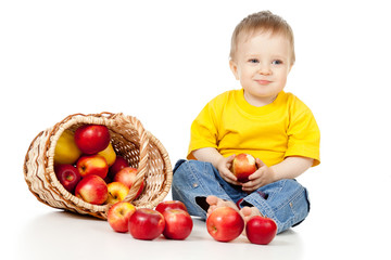 Fototapeta na wymiar Child eating apple and basket