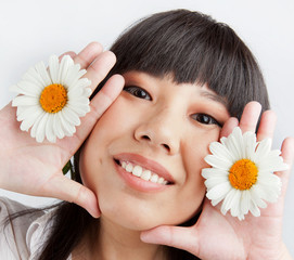 Young Chinese girl with flowers