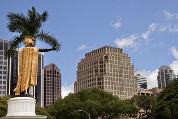 golden statue and buildings