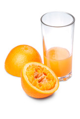 One squeezed out orange and juice on a white backgrop
