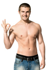 Handsome male model topless showing OK sign