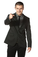 Portrait of a smiling young business man pointing