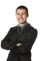 Young  businessman standing with folded hands