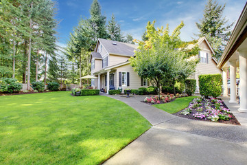 Beige house with a large back yard