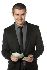 Young business man counting Euro money