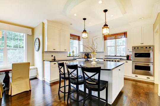White large luxury modern kitchen wih dark floor