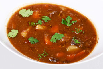 A bowl of beef vegetable soup