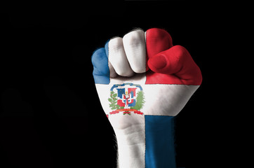 Fist painted in colors of dominica flag