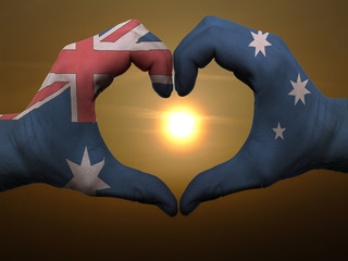 Heart and love gesture by hands colored in australia flag during