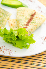 Pancake with herbs in the plate