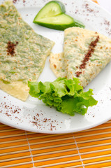 Pancake with herbs in the plate