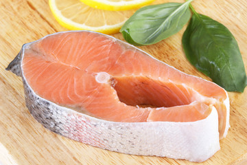 A piece of salmon on a cutting board