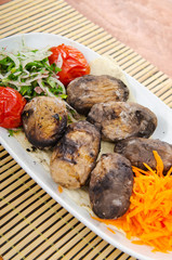 Baked potatoes in the plate
