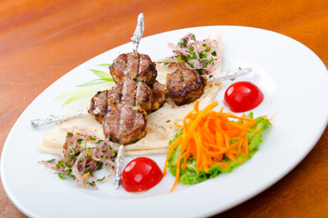 Meat cuisine - kebab served in plate