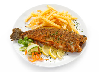 Fish dish - fried fish, French fries and vegetables