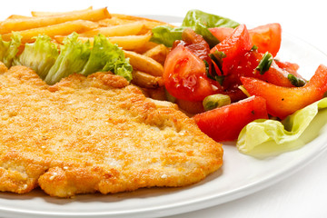 Pork chop, French fries and vegetables