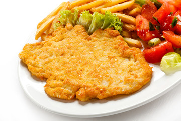 Pork chop, French fries and vegetables