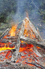 Burning timber with smoke