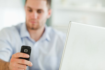 Mobile phone being used by businessman
