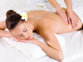 Fototapeta na wymiar Massage for the back of woman in spa salon