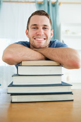 Obraz premium Happy student with his books