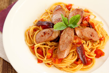 Pasta with sausage and tomato