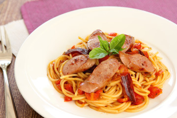 Pasta with sausage and tomato