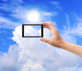 Hand to hold card, mobile phone, tablet PC on blue sky