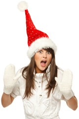 Funny girl in red santa hat shocked and surprised