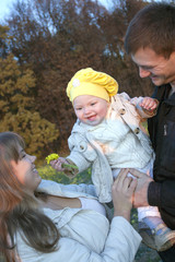 Young parents with the baby